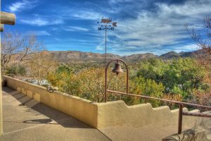 Downstairs and upstairs wrap around porches offer startling desert views.